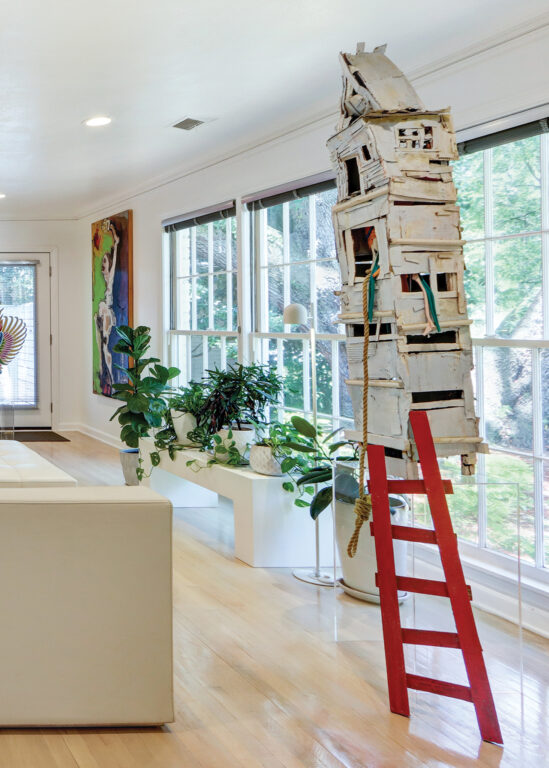 A birdhouse-like sculpture in a living room