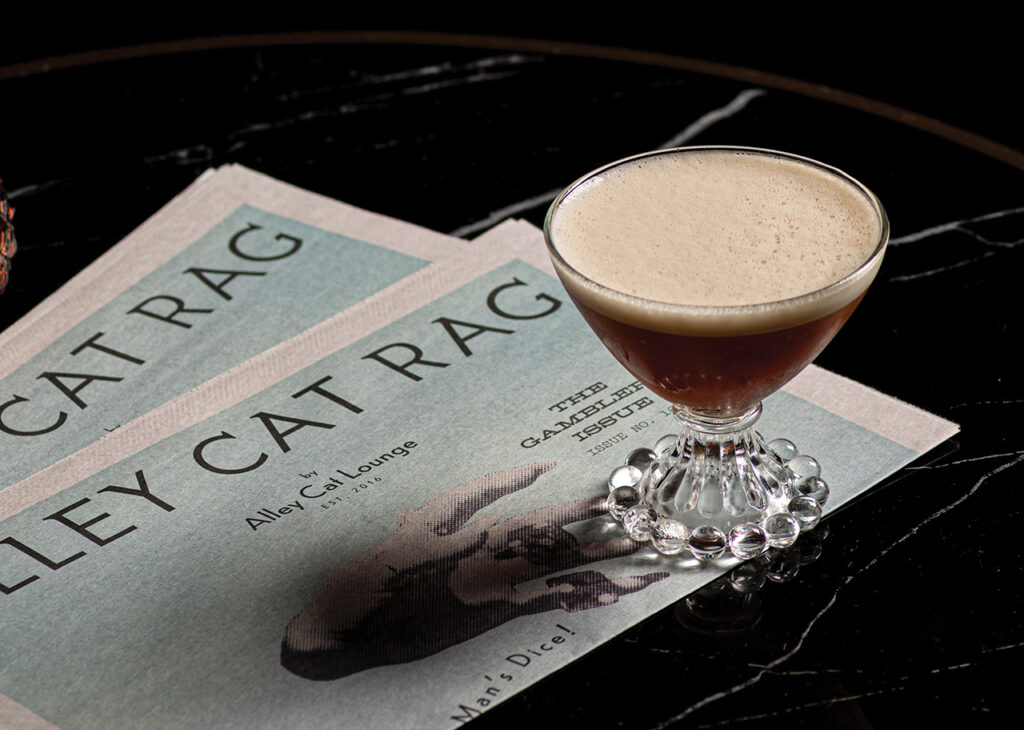A cocktail and a printed community newsletter