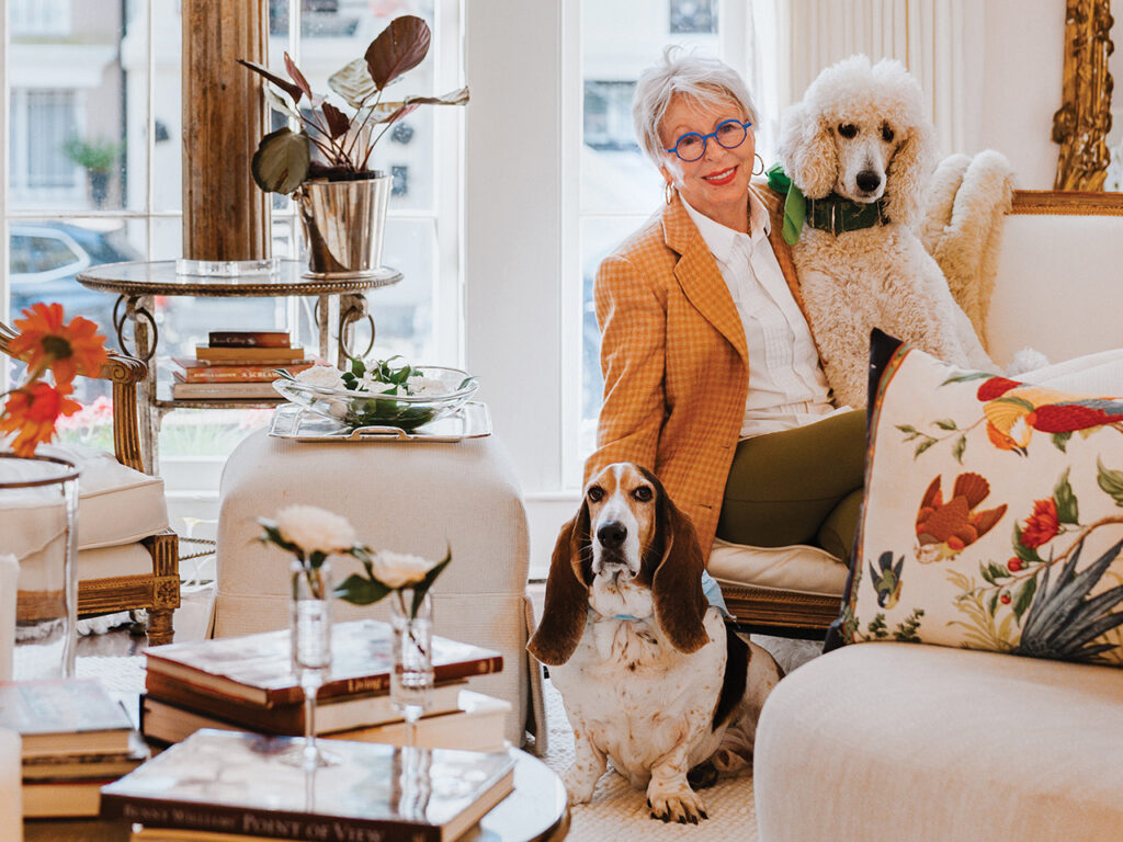 Cora Bett Thomas with her standard poodle, Phoebe, and basset hound, Leon.