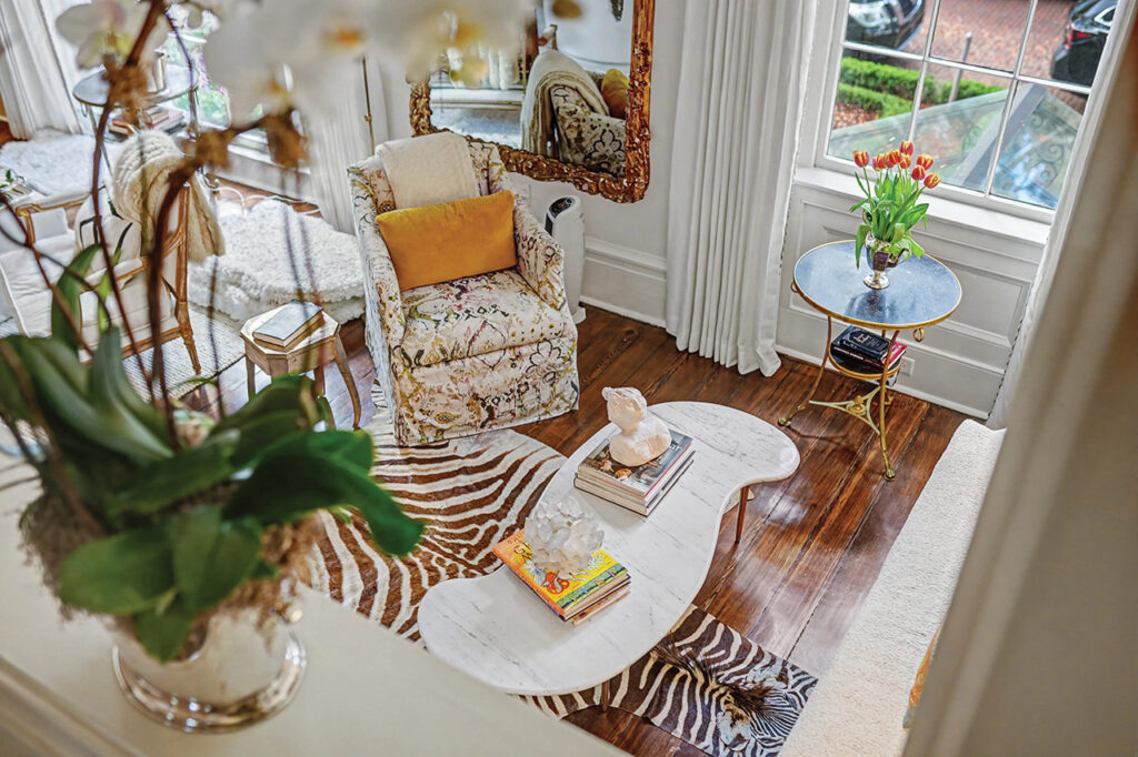 A living room nook with a zebra skin rug