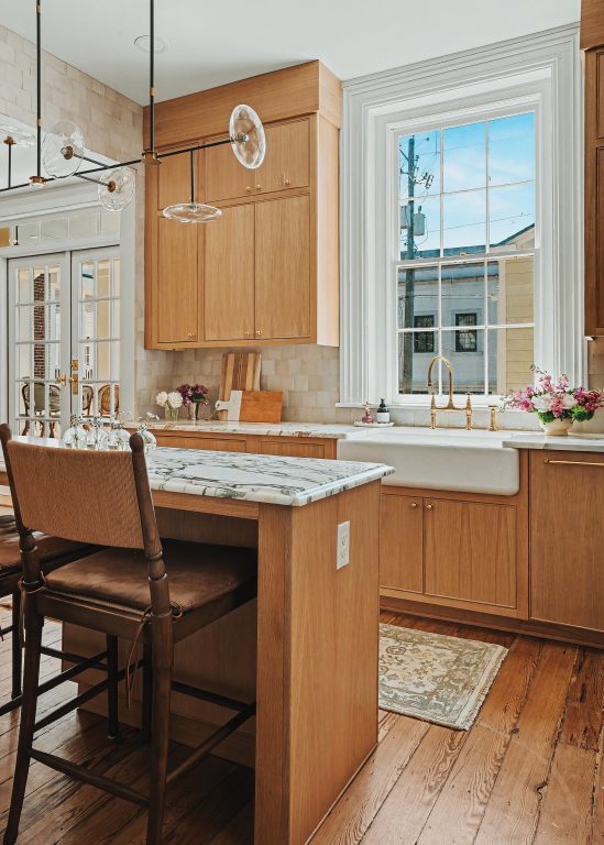 A kitchen with Italian marble countertops and an island