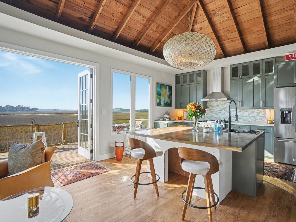 Open concept kitchen and living room with views of the marsh