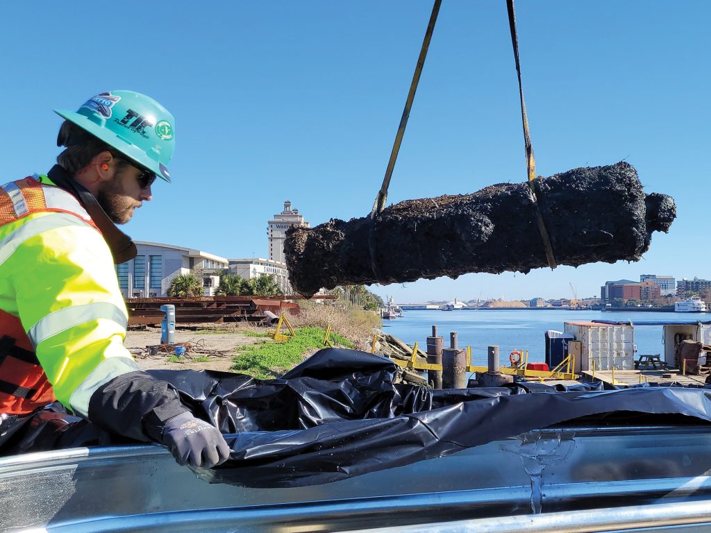 old cannon being lifted out of the water