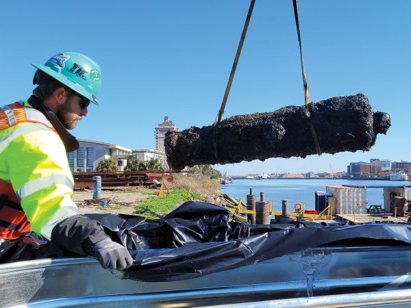 old cannon being lifted out of the water